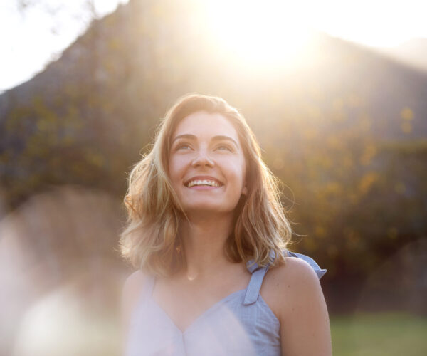 candid fun in the park happy sunrise woman with beautiful smile full of optimism